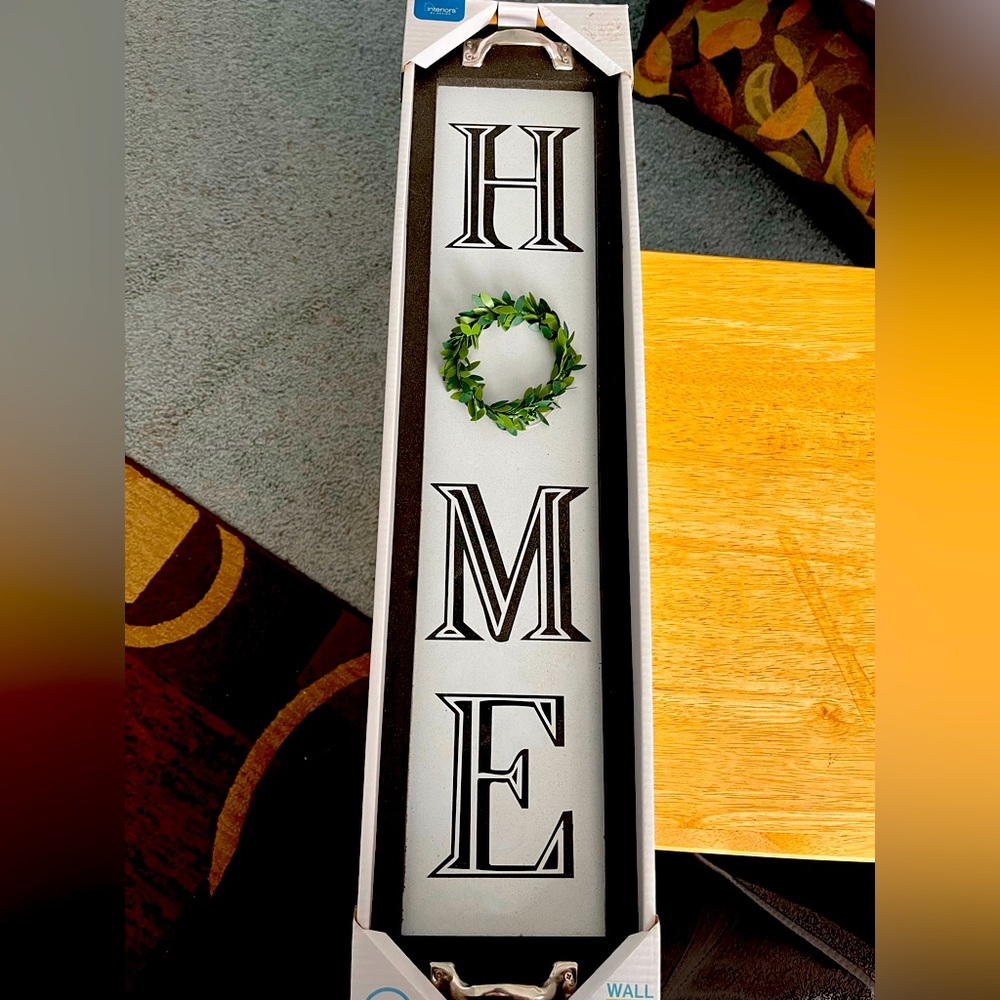 5.2 inch by 23.6 inch “home” wall plaque.  Never opened
